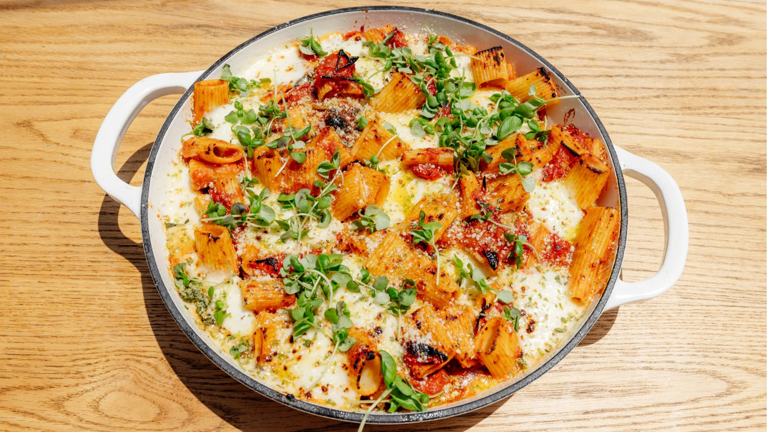 Baked Rigatoni with blistered cherry tomatoes, fresh mozzarella and fennel pollen