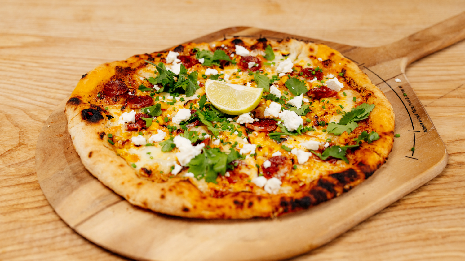 Miso Butter Pizza served on wood serving board