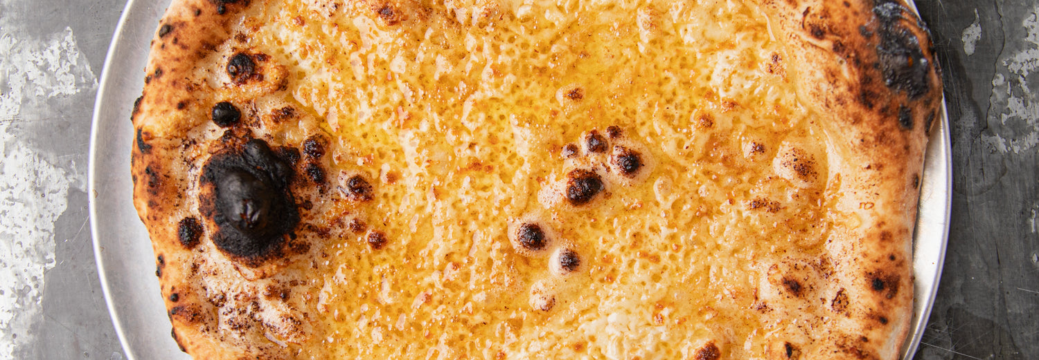 Cheesy Miso Garlic Bread - Gozney . Roccbox recipe poster image