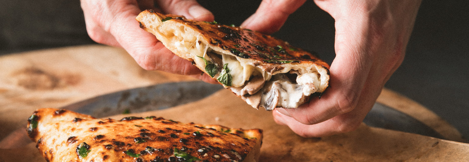 Mushroom and ricotta calzone with garlic butter Recipe - Gozney / Roccbox recipe poster image