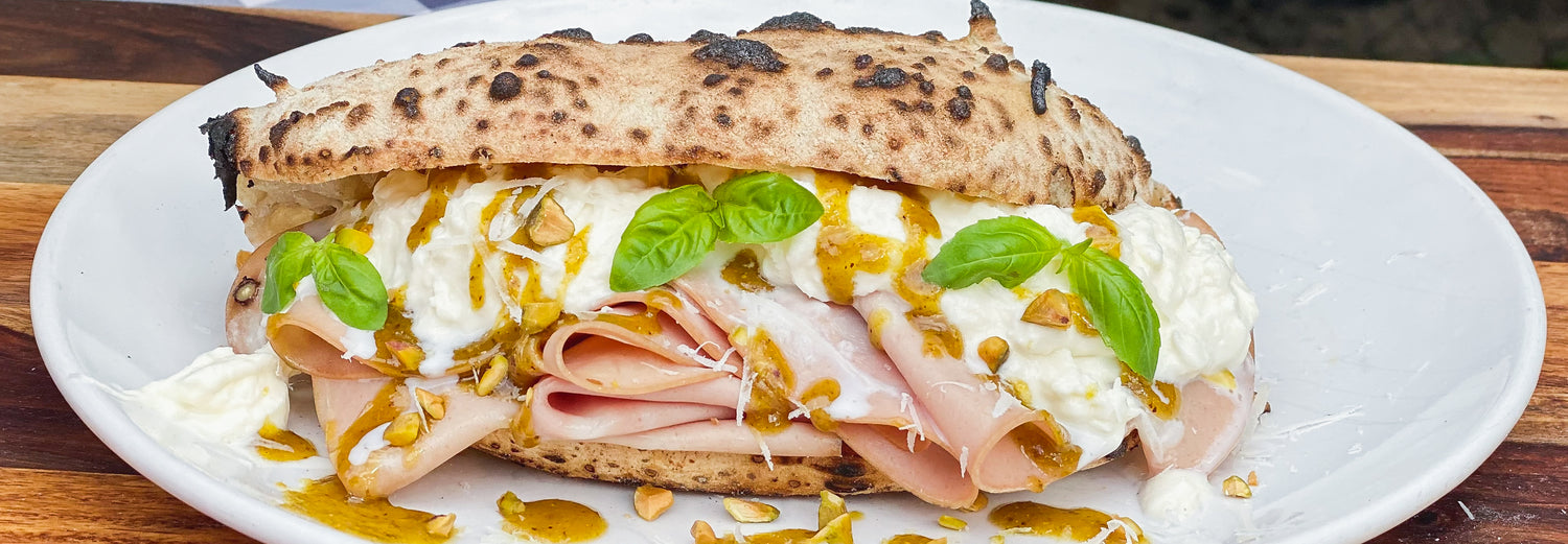 Mortadella Panuozzo with Stracciatella, Pistachio Pesto and Pecorino Romano Recipe - Roccbox