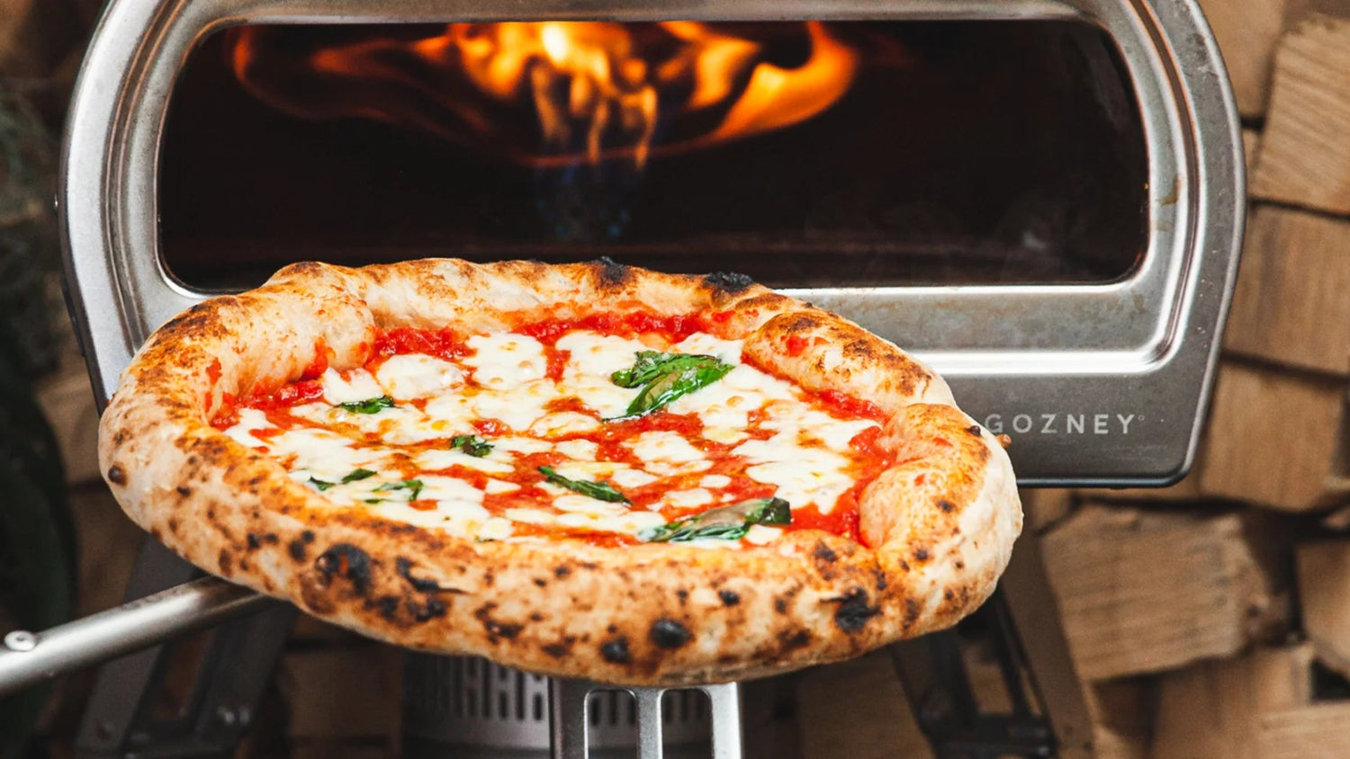 Pizza pulled out of a Gozney Roccbox recipe poster image
