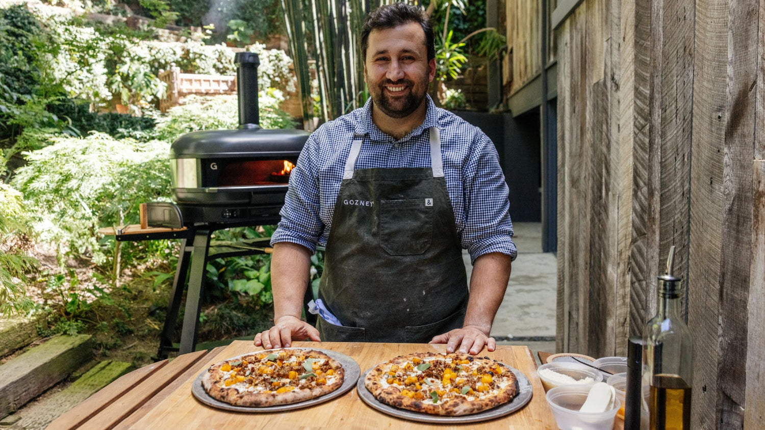 Chef Daniele Uditi standing in front of the Gozney Dome (Gen 2) with two pizzas in front of him. recipe poster image