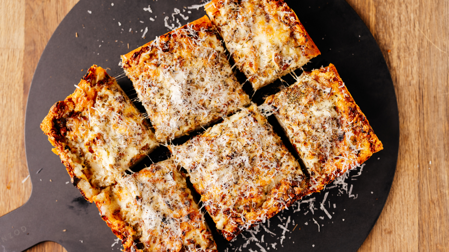 Mushroom Detroit Style Pizza Cut into 6 slices on Gozney Pizza Server recipe poster image