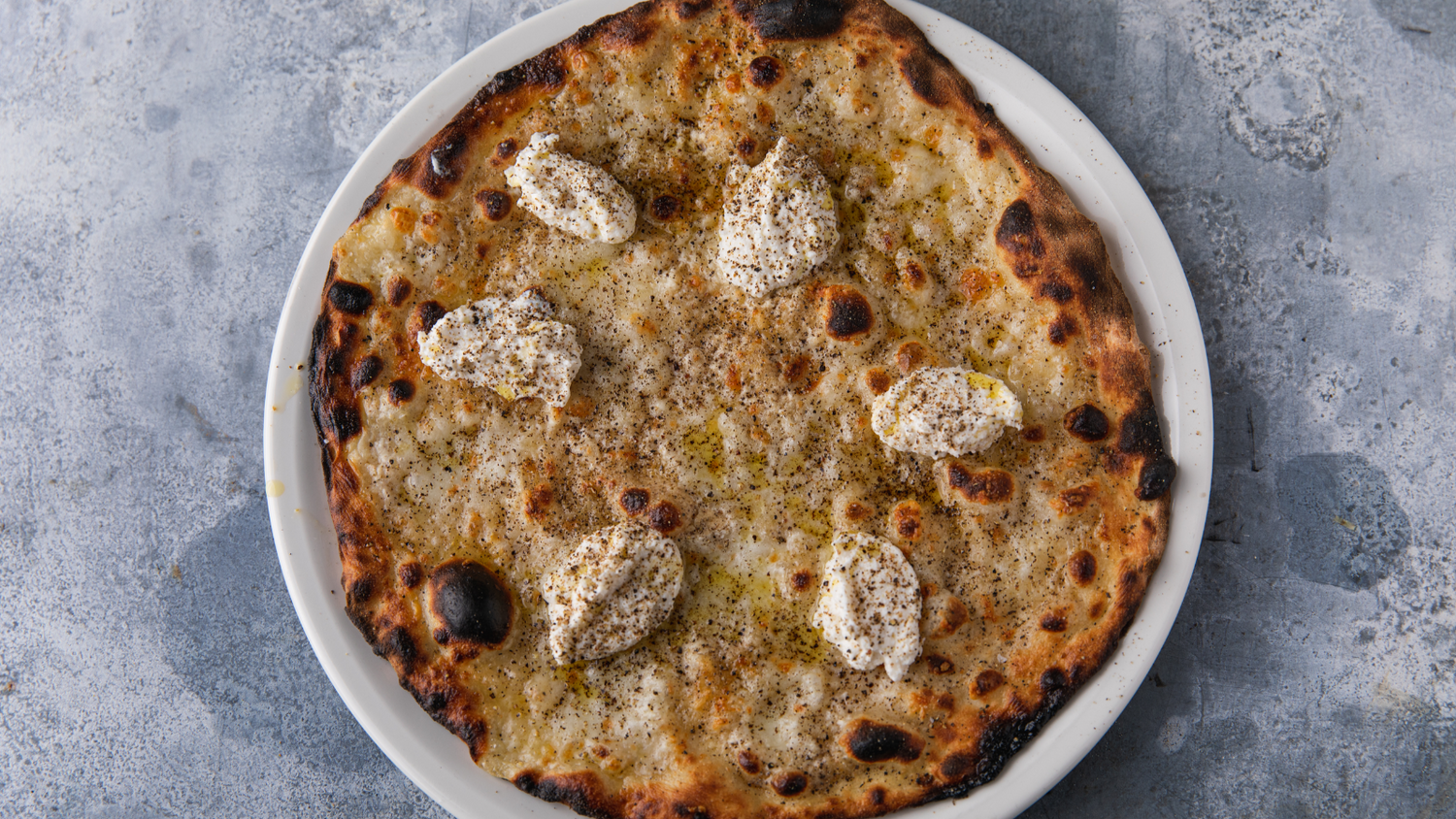 Cacio e Pepe pizza on a plate recipe poster image
